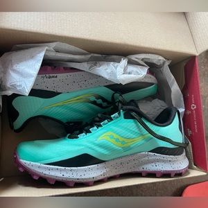 Brand new saucony running shoes. Never worn in box size 8.5